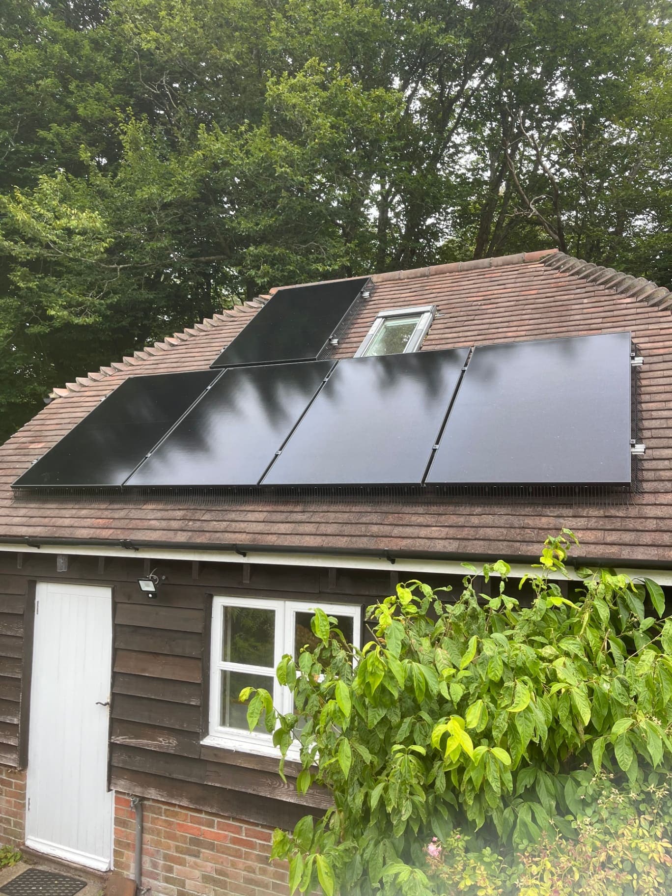 All-black solar PV panels installed on a tiled roof